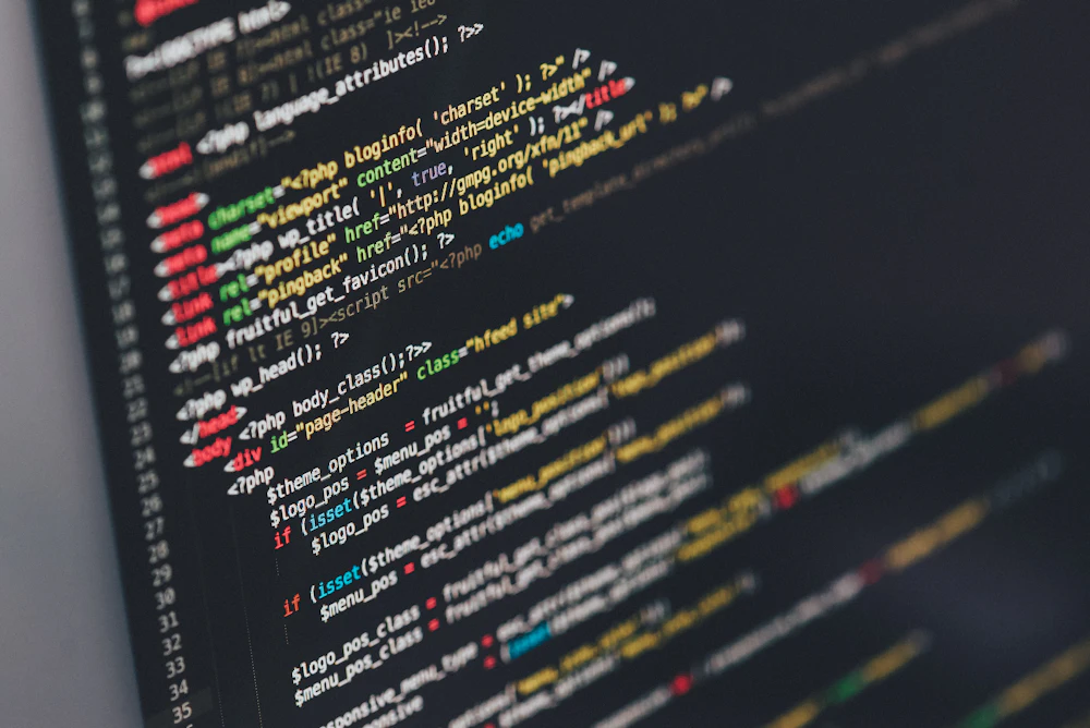 Developer writing code for a modern responsive website